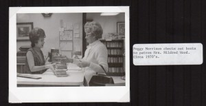 Peggy Morrison checks out books to library patron, Mrs. Mildred Woods, in the 1970’s. “Did we really wear our hair like that? Yes, we did!” says Jo Moore.